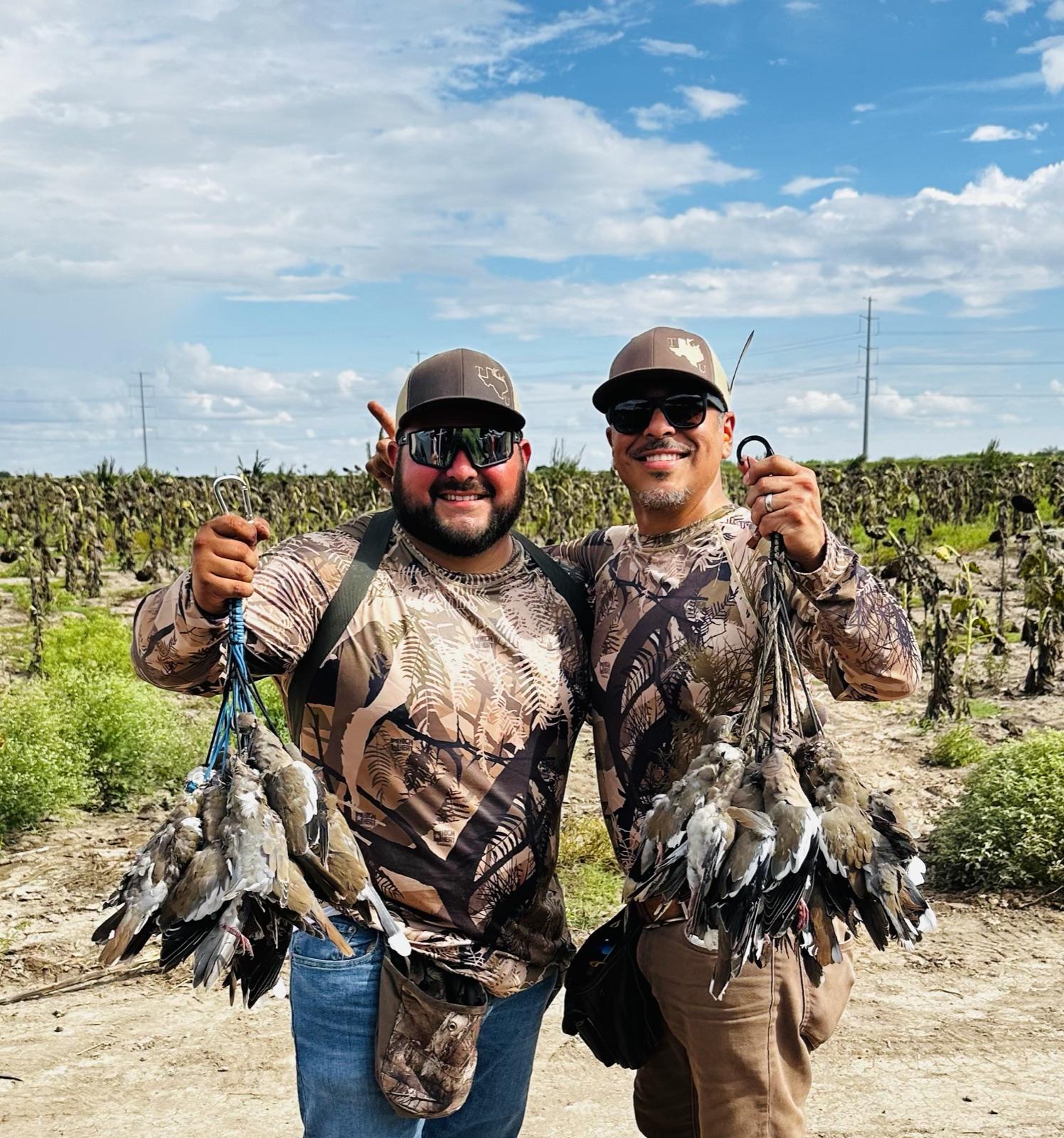 Two hunters with full dove straps after a Valley morning hunt