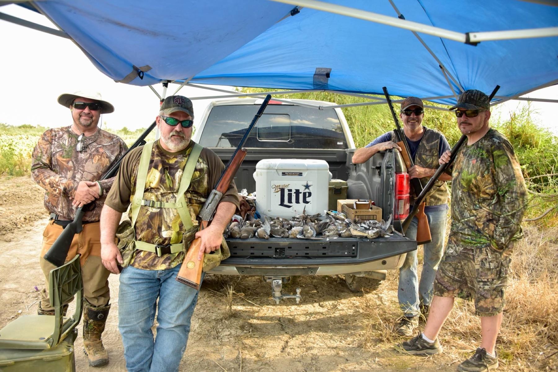 The crew under the canopy after an opening-weekend dove shoot